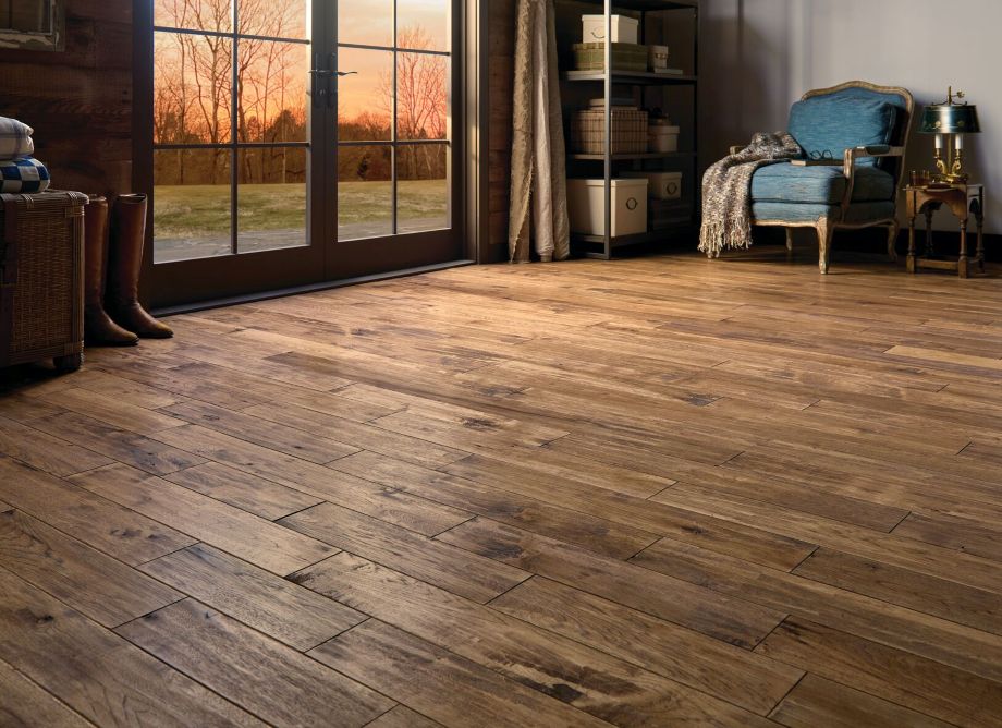 Hickory hardwood floor in a living room with patio doors; hand-scraped hardwood