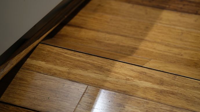 Buckled wood flooring; wood flooring acclimation